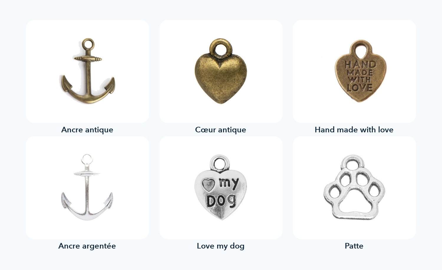 Les six charms&nbsp;: ancre antique, cœur antique, cœur «&nbsp;hand made with love&nbsp;», ancre argentée, cœur «&nbsp;love my dog&nbsp;» et patte